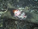 Coal-burning a container. This one is very small.