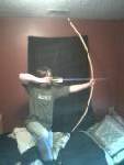 Fully bending bow made of Hickory sapling. Cured for 2 months and have had it for 6 months. I air and smoke dryed the bow for a nice dark color, and it's rubbed good with fat. Pulls 45 pounds at 26 inches draw. Very good bow. bowstring made from handmade Yucca cordage. Fires around 110 miles per hour. This one is selling for 40 $, made from stone tools, carved when green.