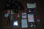 inner sanctum (detachable from car kit for unplanned hikes) 
hurricane matches 
waterproof matches 
electrical tape 
headlamp (incandescent w/ spare...