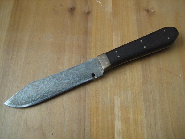 coffin handle bowie
1095 high carbon steel
brass pins and bolster
walnut handle