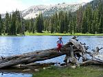 Son near lake in High Uintas