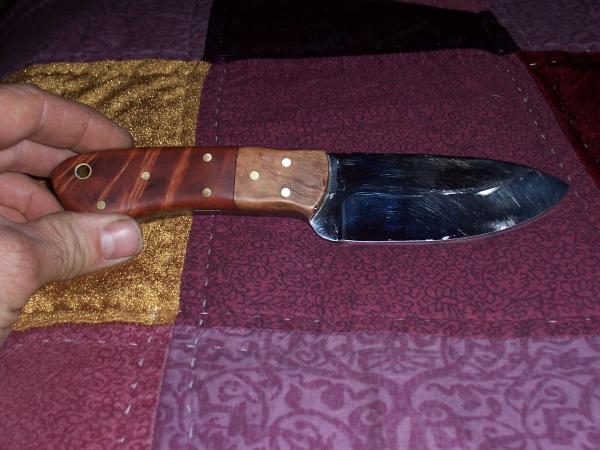 Thuya burl with ramone burl bolsters.
