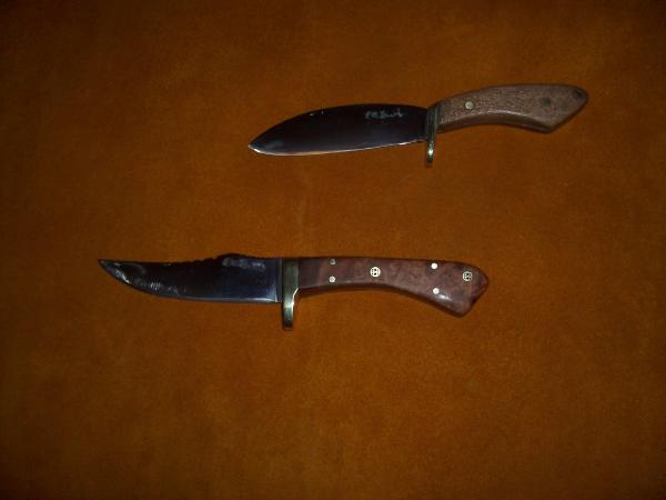 One in the middle is my first fighter!  It is also the first knife that I sold for some real money.  The other was designed by and made for a friend.