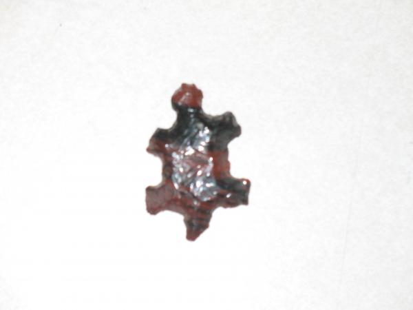 a decorate obsidian turtle, knapped by my Dad