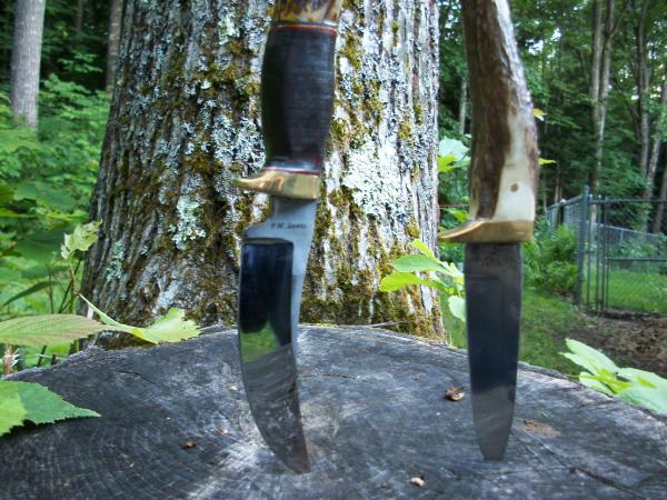 two forged knives.  The one to the right was my first try with the anvil.